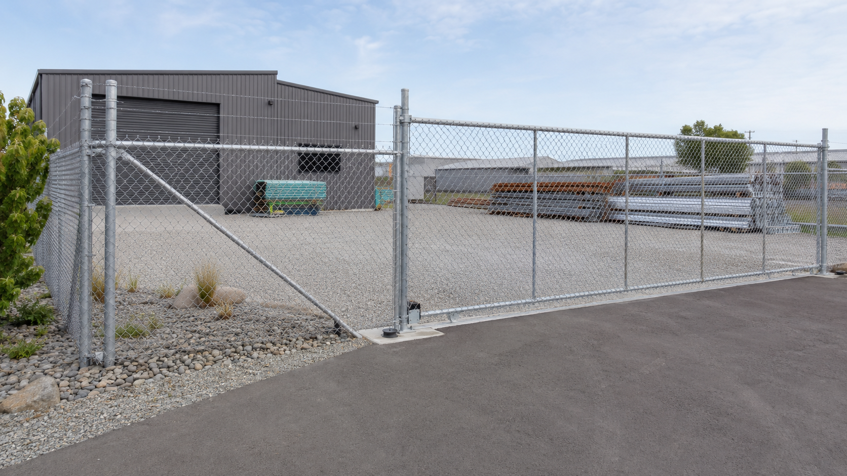 Chain link security fencing with sliding gate around a commercial construction site in New Zealand